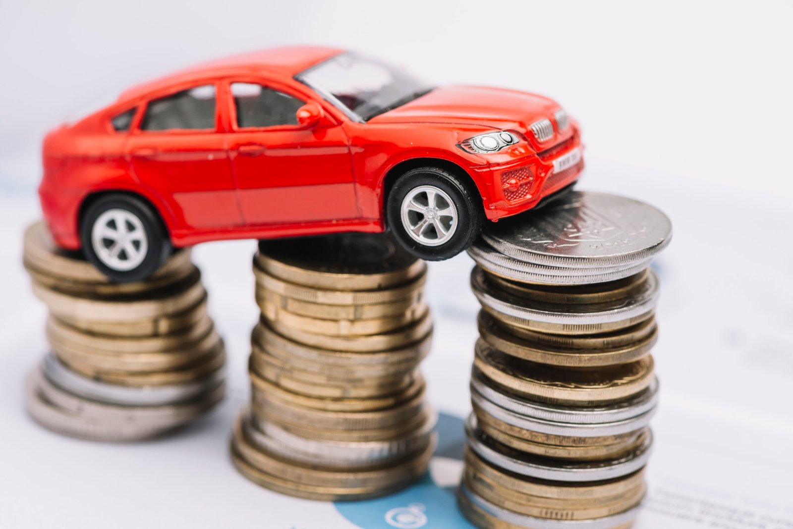 small-red-car-stack-increasing-coins